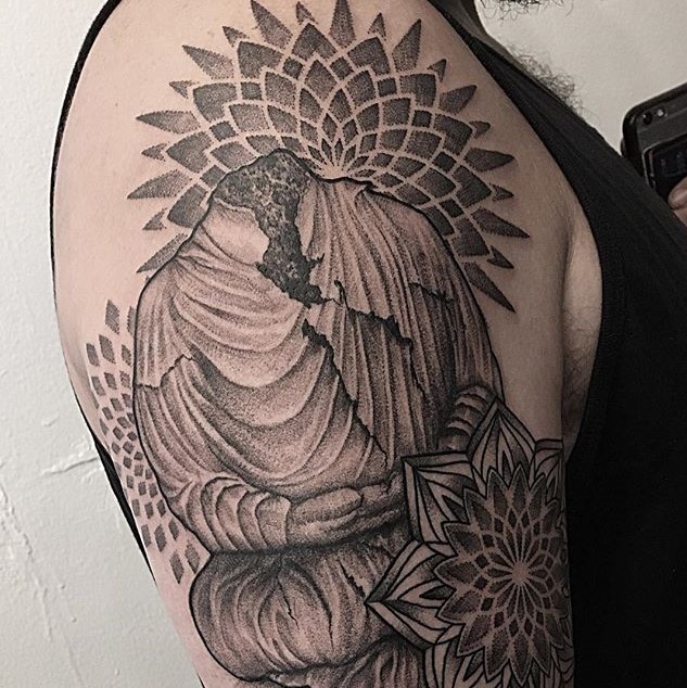 Custom Upper Arm Tattoo of a Headless Buddha Statue Surrounded by Mandalas. Tattoo created by Tattoo artist Alan Lott at Sacred Mandala Studio. Premium Custom Tattoo Parlor and Art Gallery for the Triangle of North Carolina. Raleigh, Durham, Chapel Hill.